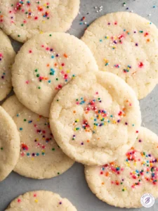 overhead pile of sugar cookies with sprinkles