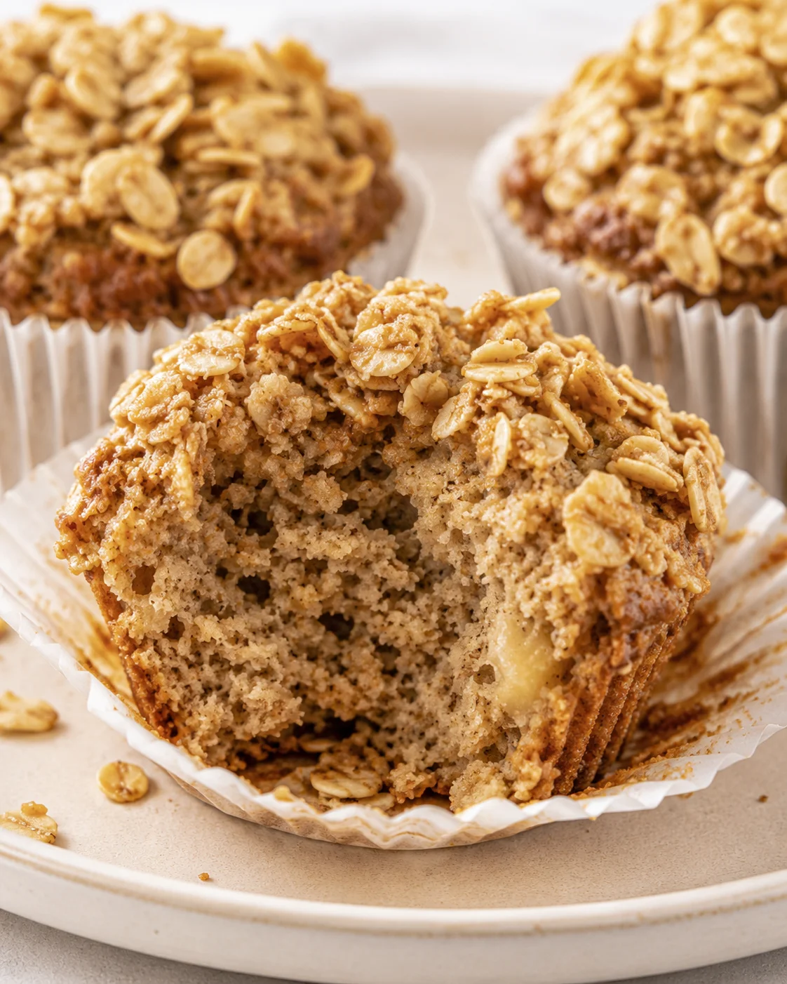 Close-up of moist, fluffy banana oatmeal muffins with oat topping