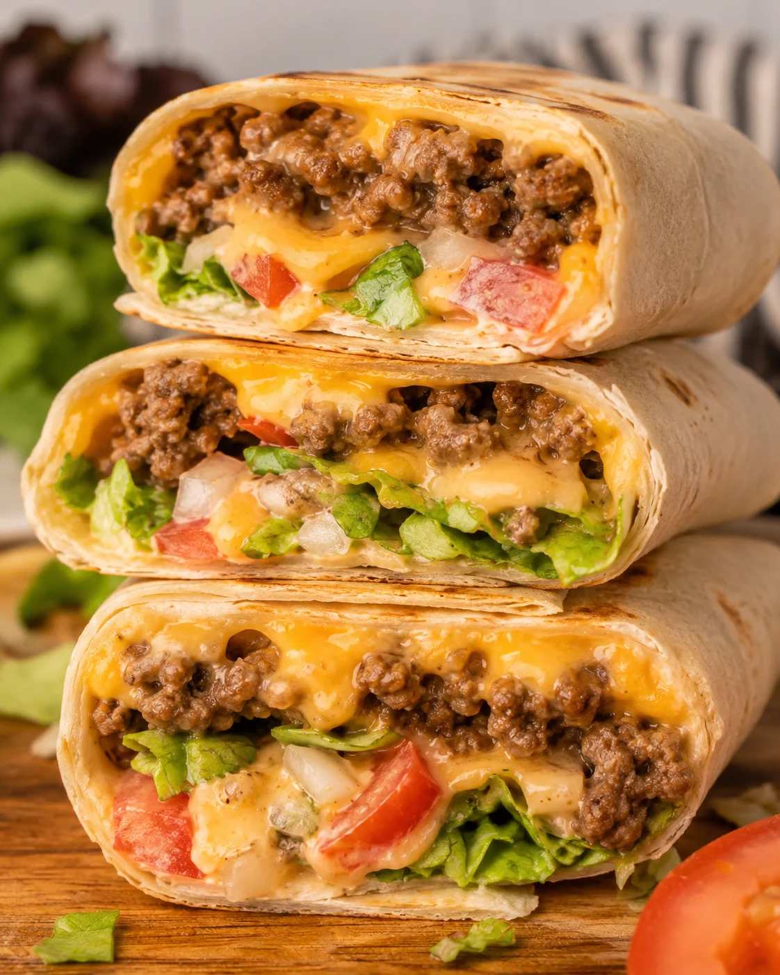 Delicious cheeseburger wraps filled with seasoned beef, cheese, and fresh vegetables.