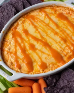 Creamy, spicy, and cheesy buffalo chicken dip with a healthier twist, baked to perfection.