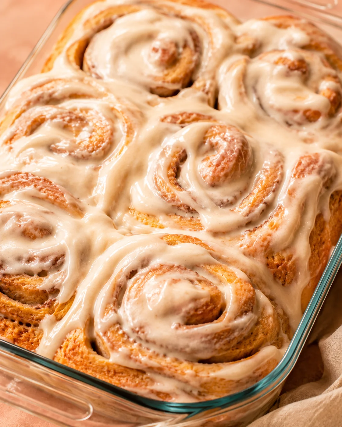 Warm, fluffy pumpkin cinnamon rolls topped with creamy brown butter frosting.